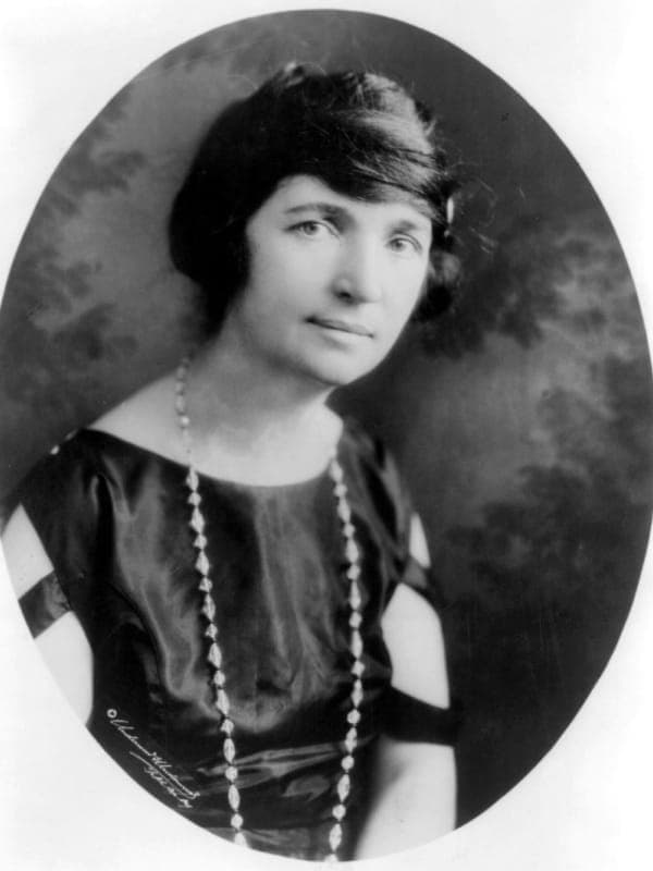 Margaret Sanger portrait, showing a determined woman in early 20th century attire